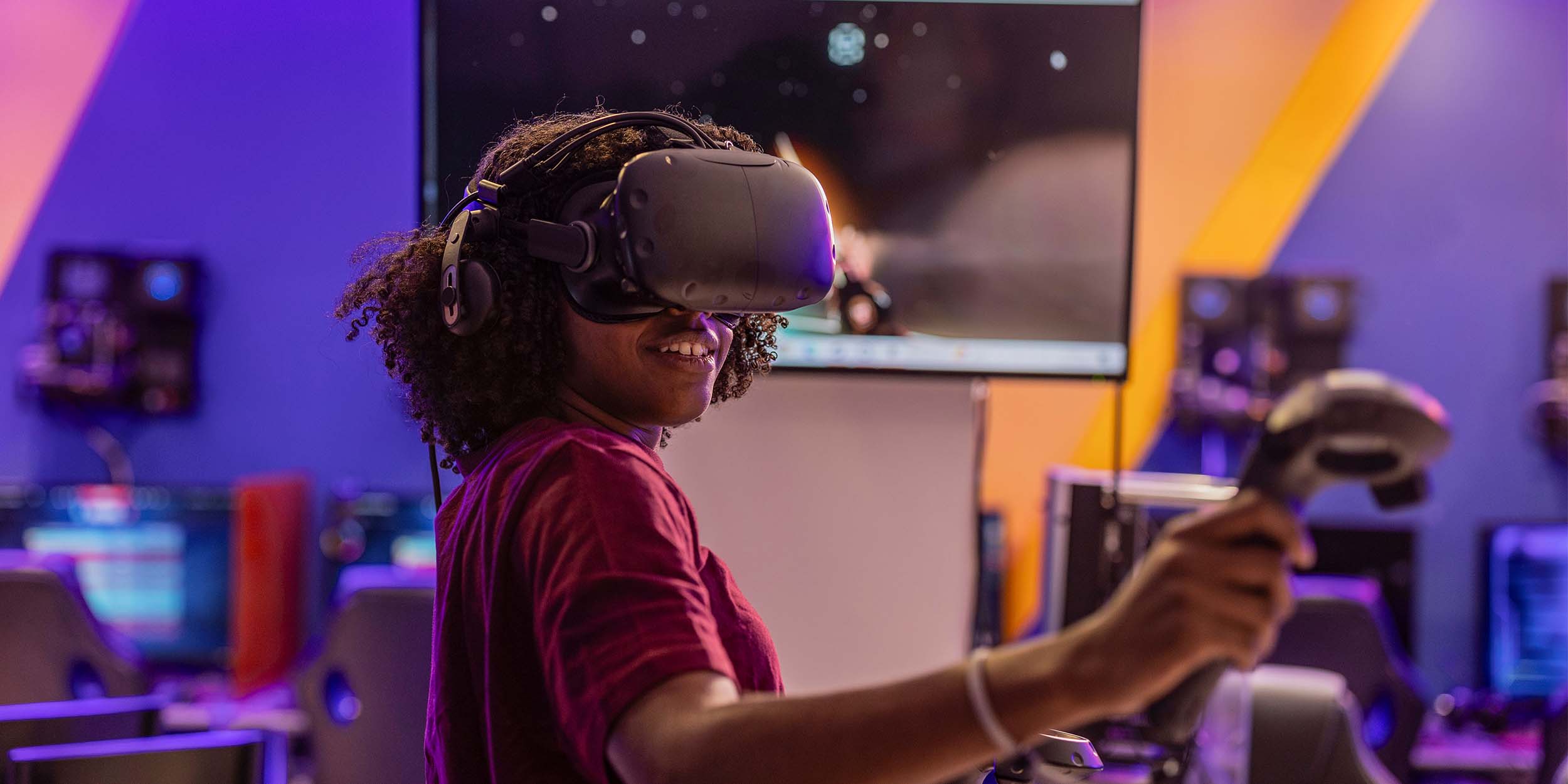 Person using a virtual reality headset and controller