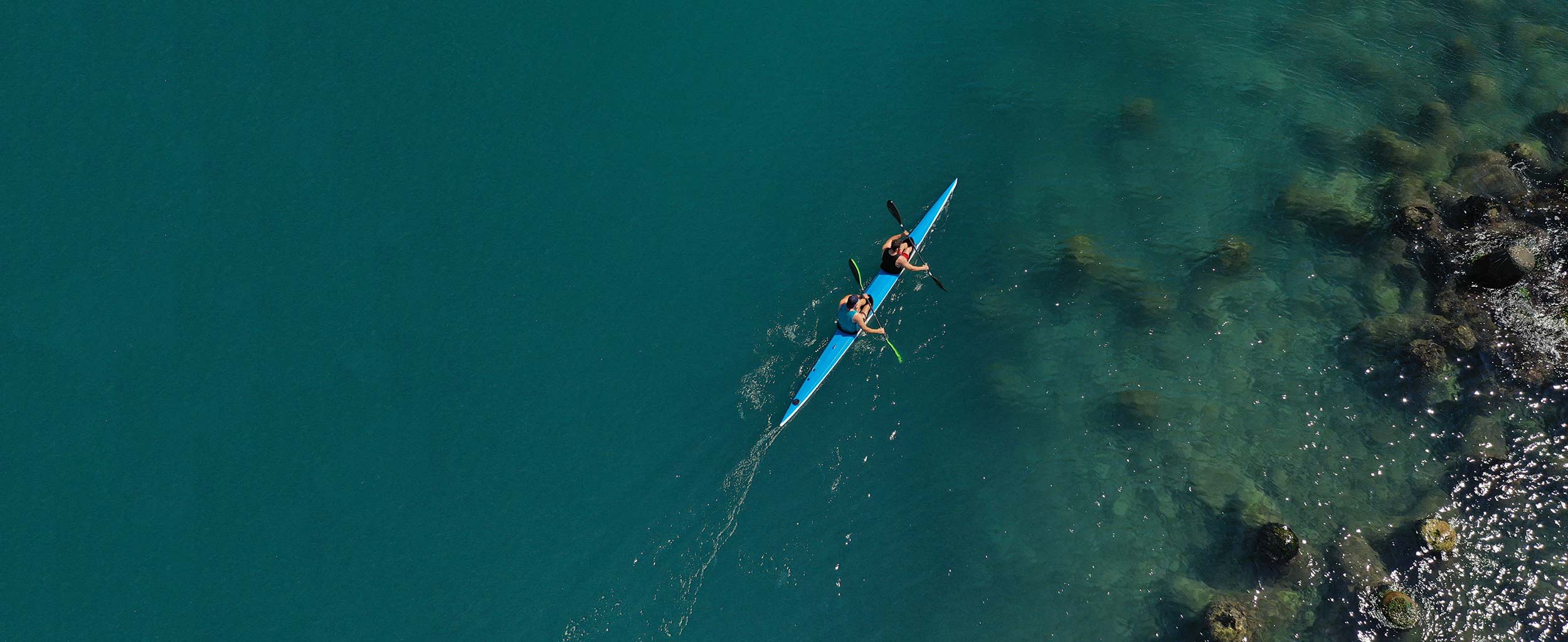 2 people in a kayak on the water