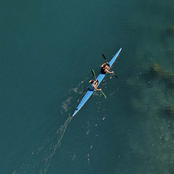 2 people in a kayak on the water