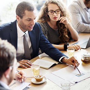 colleagues looking at reports together