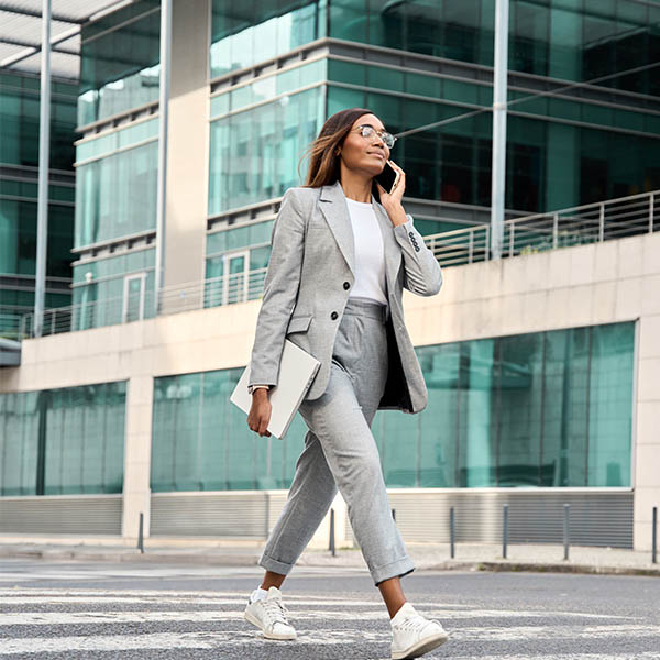 Business woman having a call outdoors