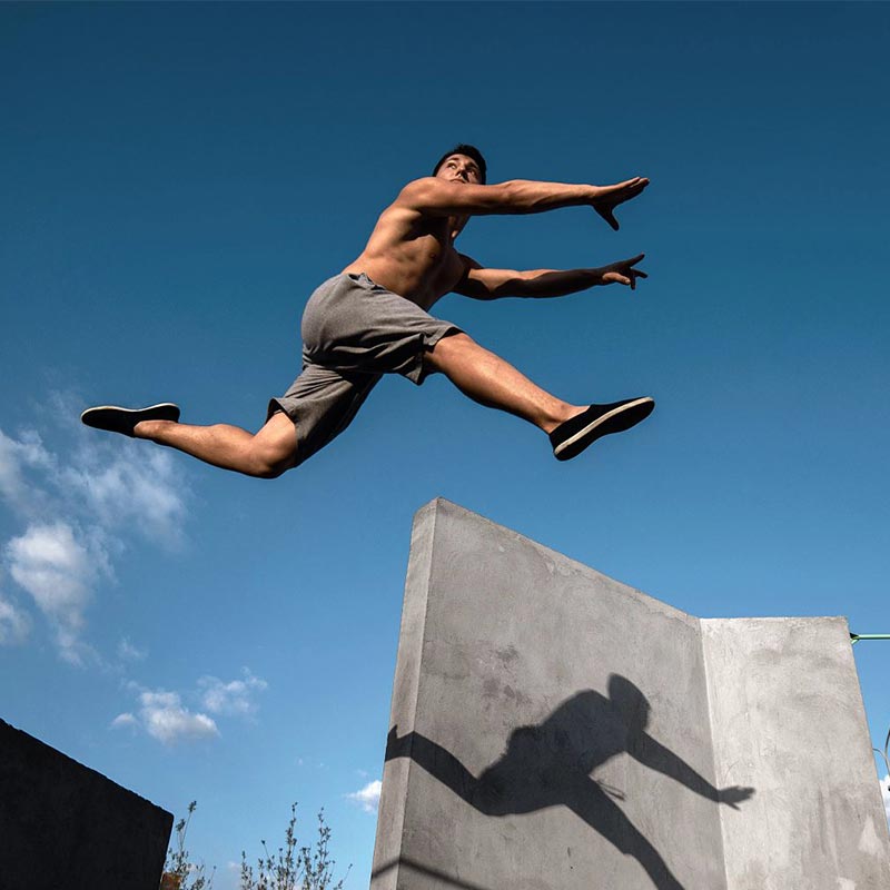 Teenager jump parkour on the walls