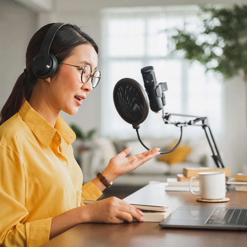 woman recording a podcast