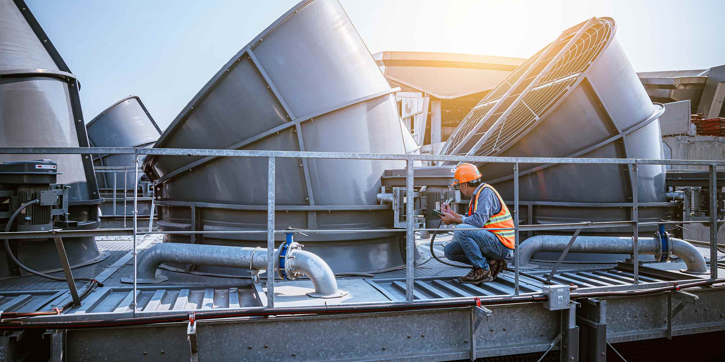 A engineer under checking the industry cooling tower