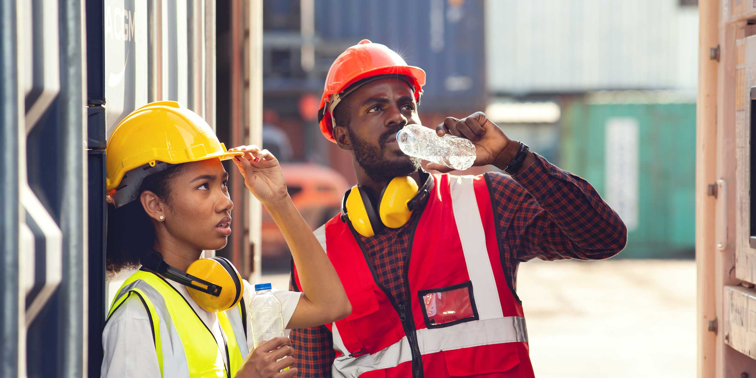 technicians drinking water and resting after working