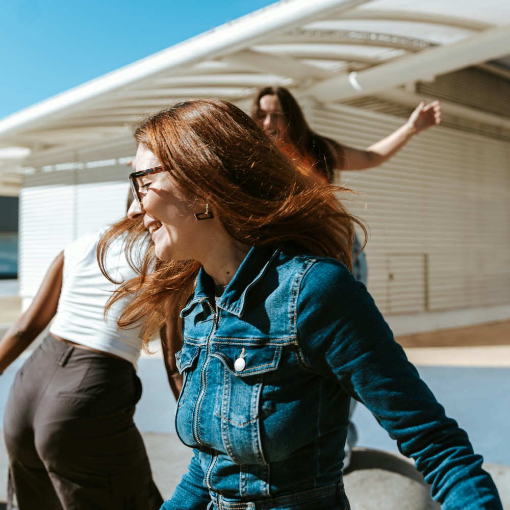 people moving outdoors near modern building