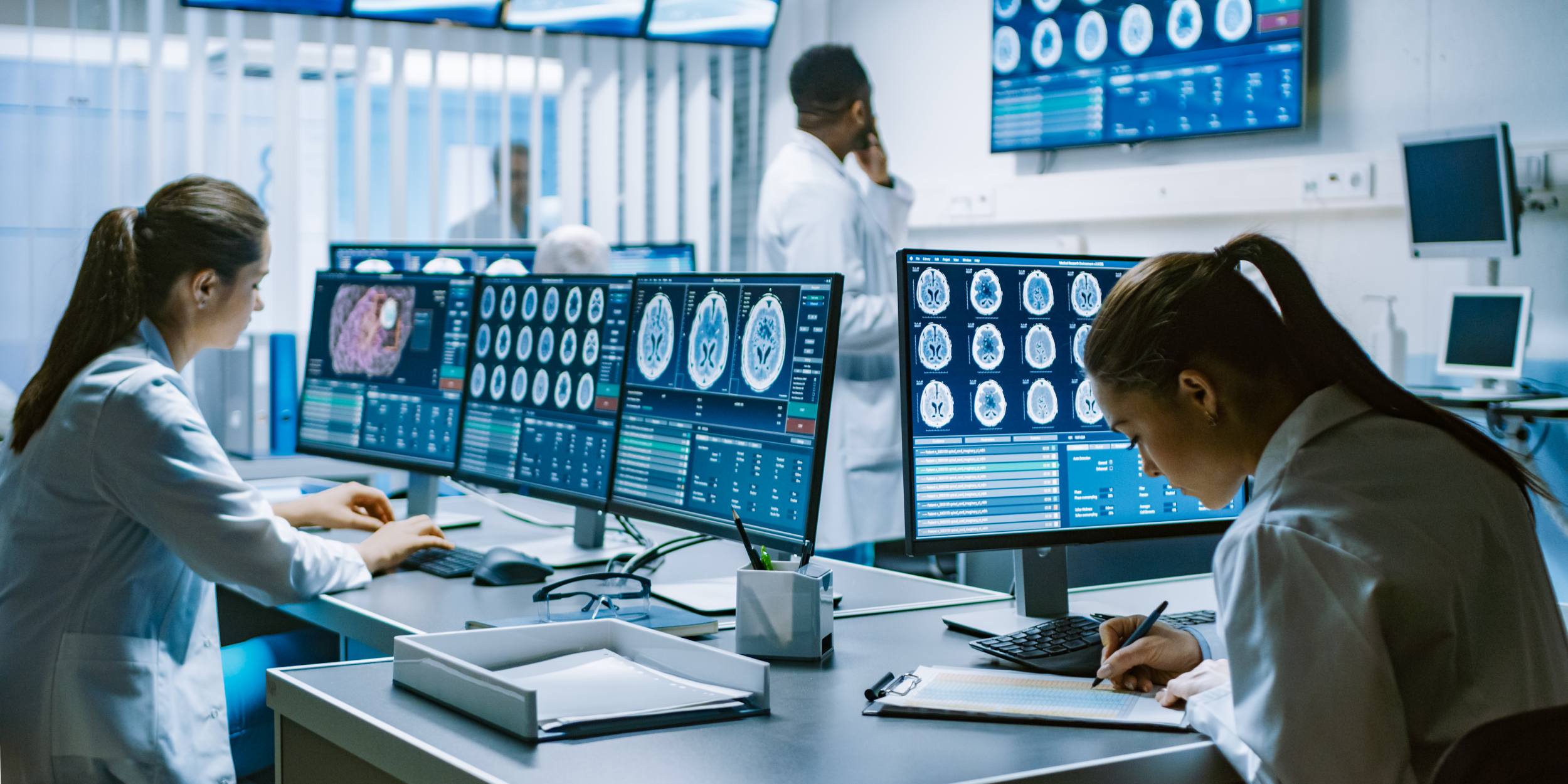 medical staff reviewing brain scan images