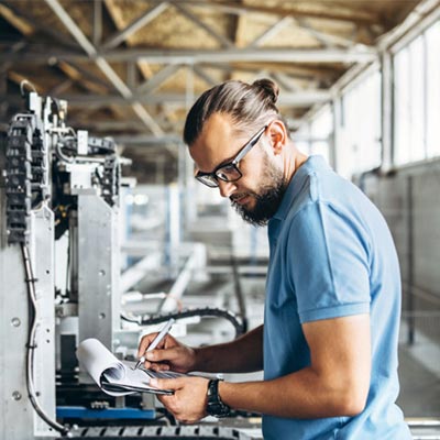 man working on a paper