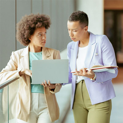 two woman talking about something