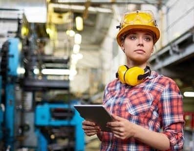 female construction worker on a tablet
