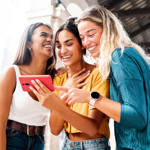 People viewing content together on a smartphone in a social setting