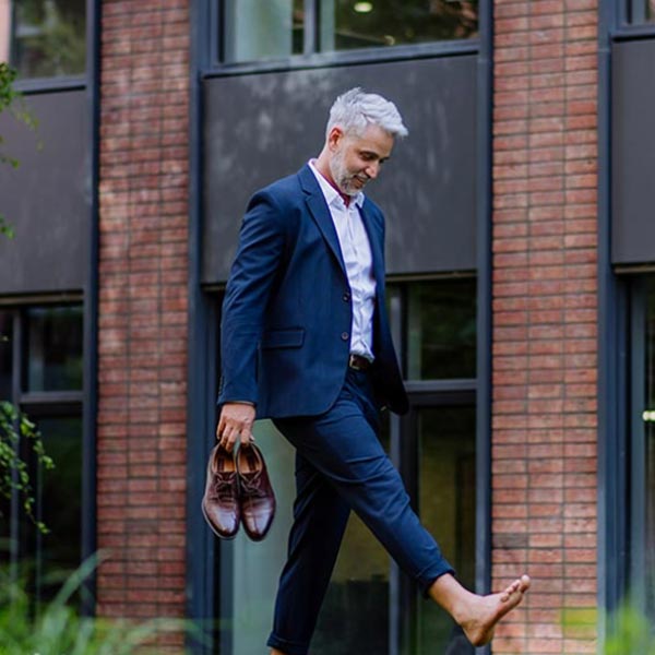 man walking barefoot