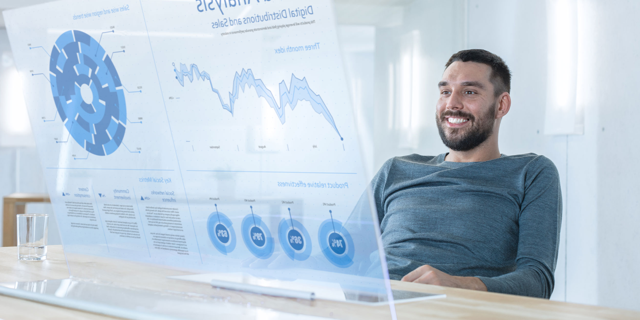 man looking at a futuristic computer screen