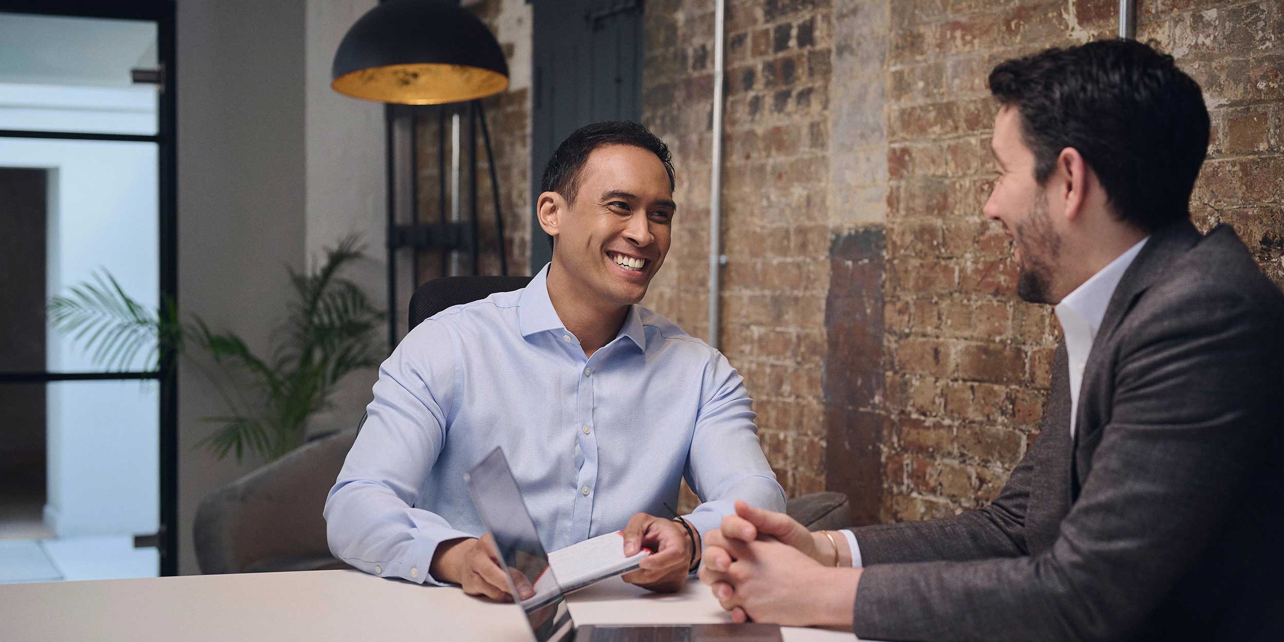 two men in a meeting