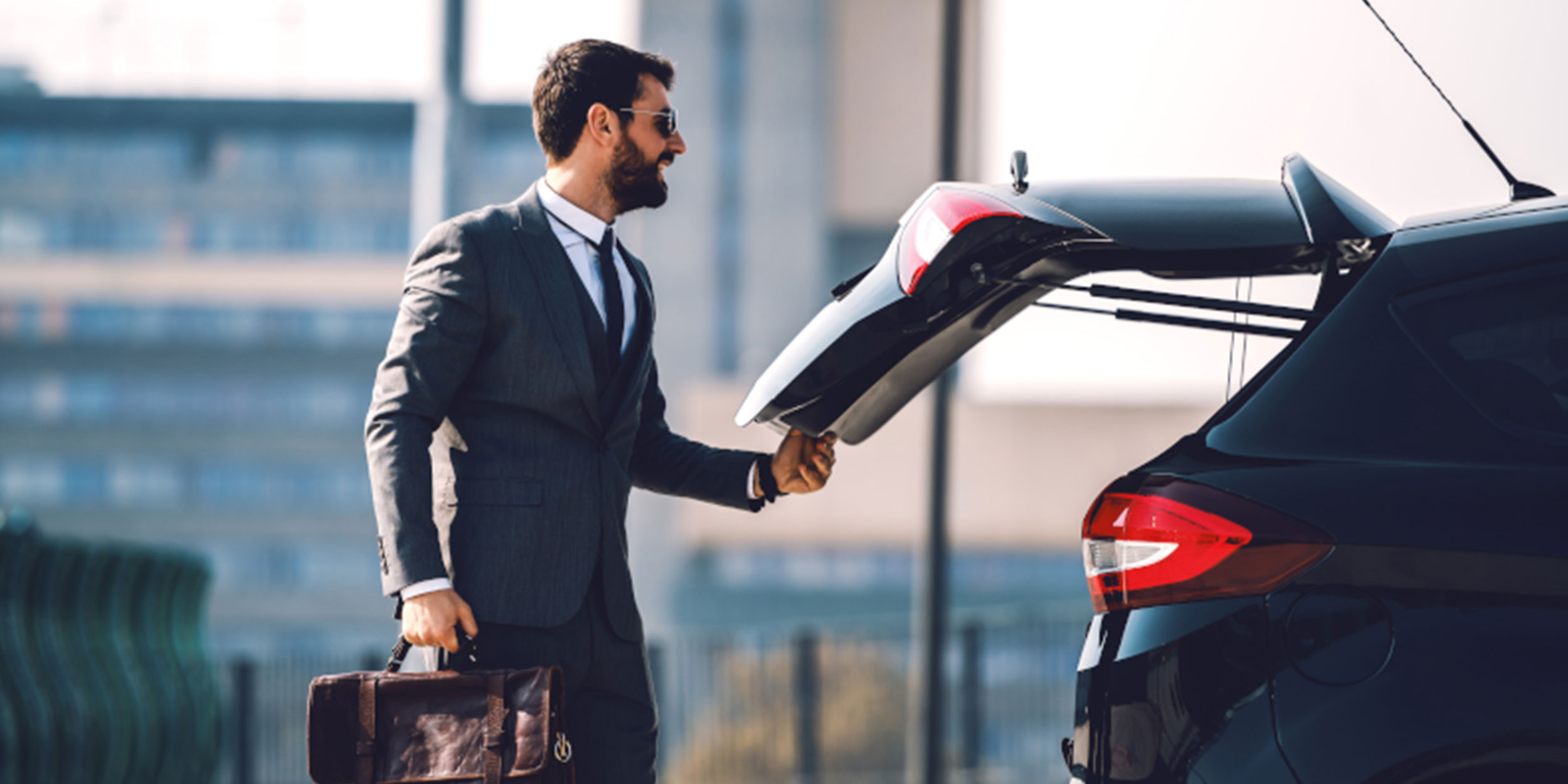 man closes the trunk