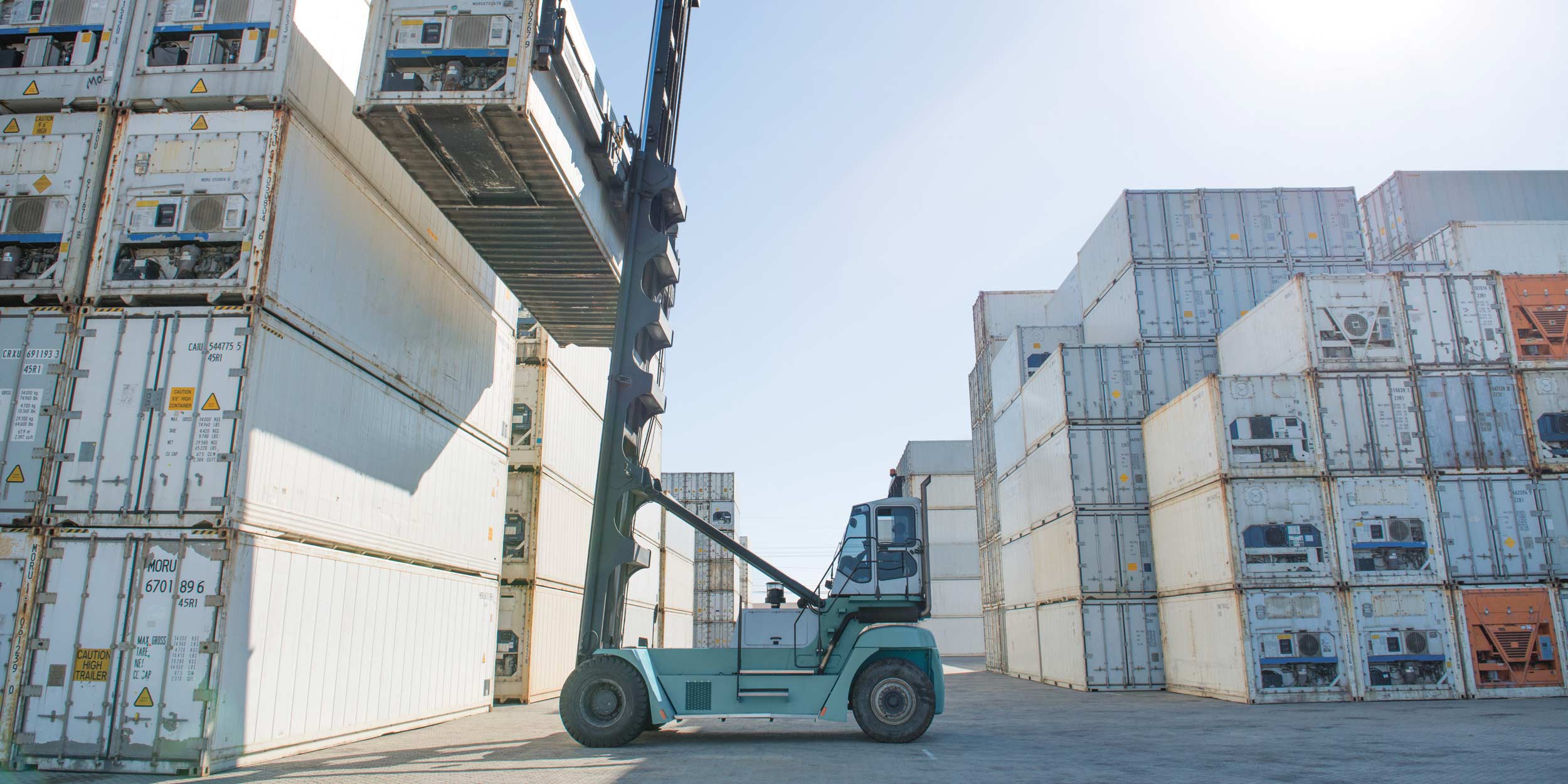 A lift truck carrying a container