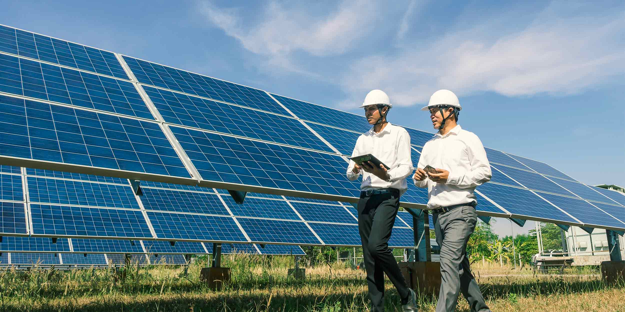 solar farm with two engineers