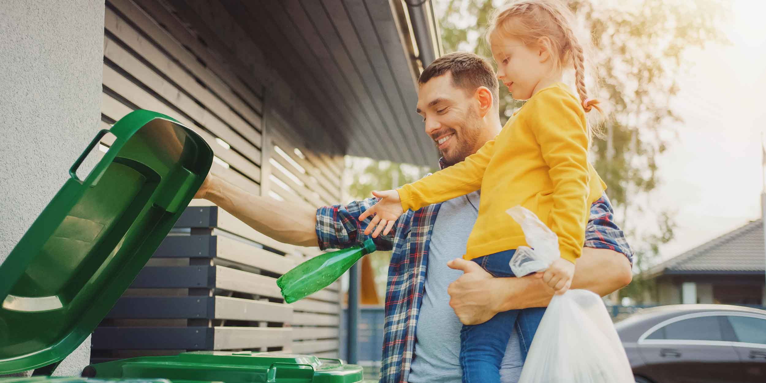 father and daughter recycling