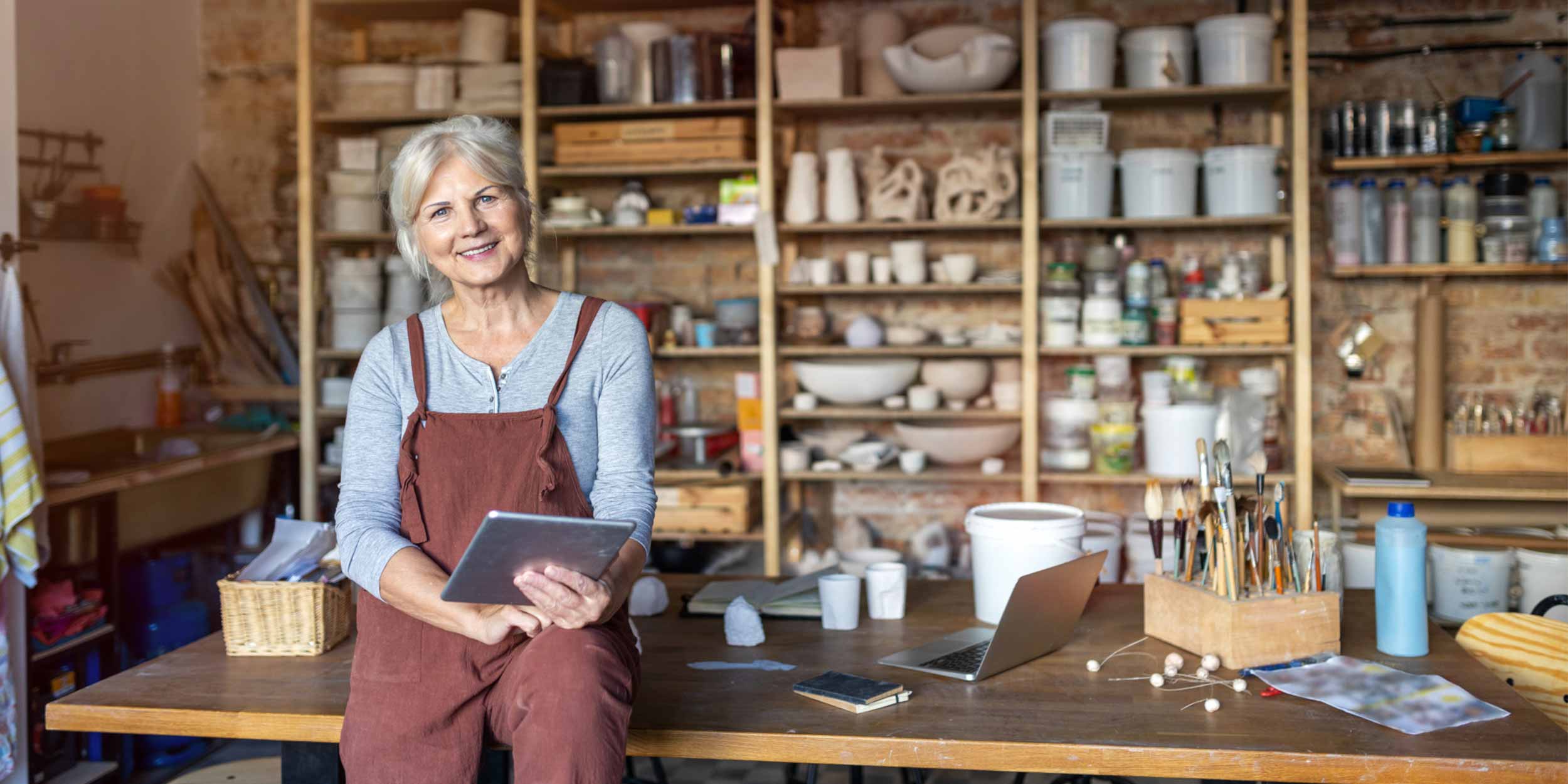 woman with tablet smiling
