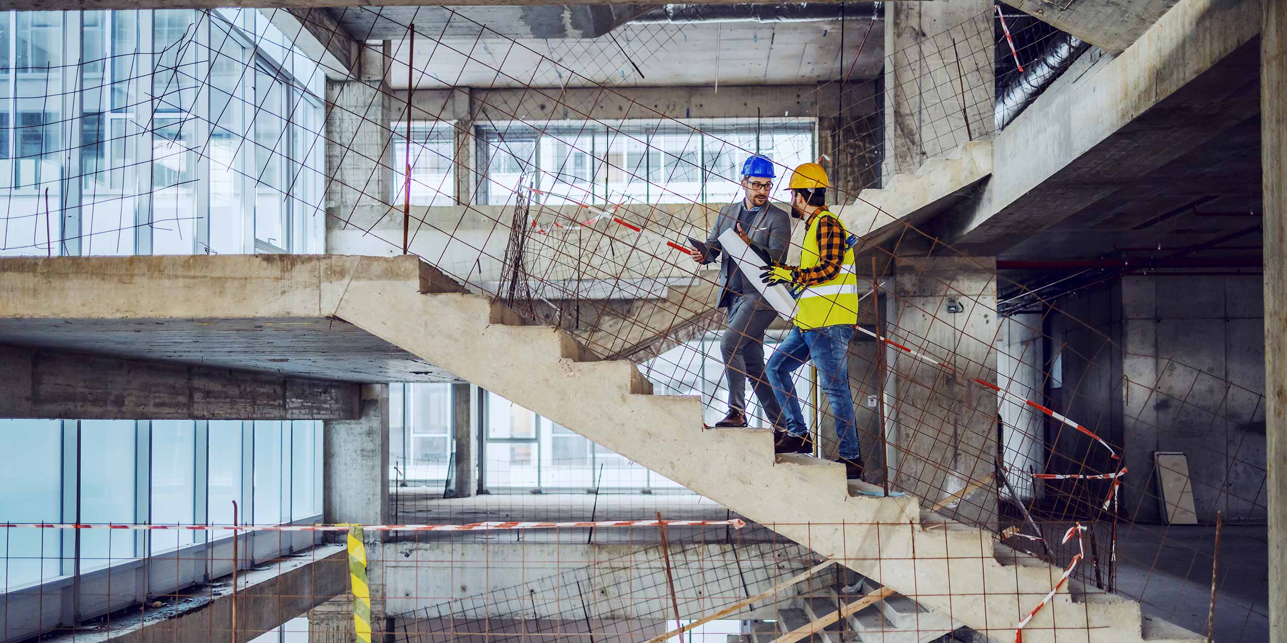 construction worker and architect are talking