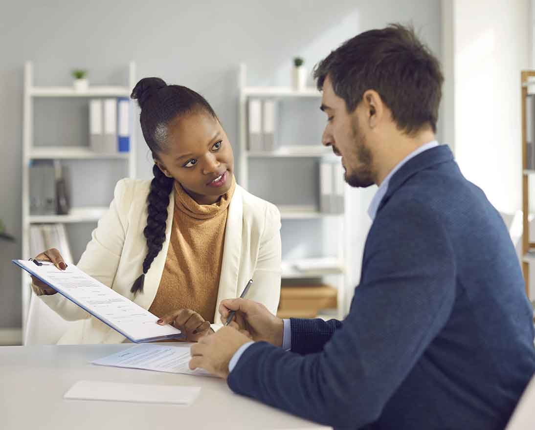 two colleagues discussing a paper