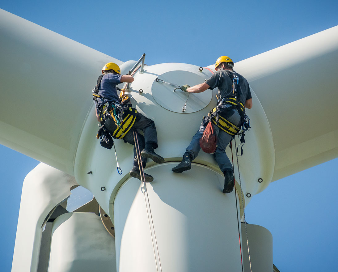 workers on a wind turbine