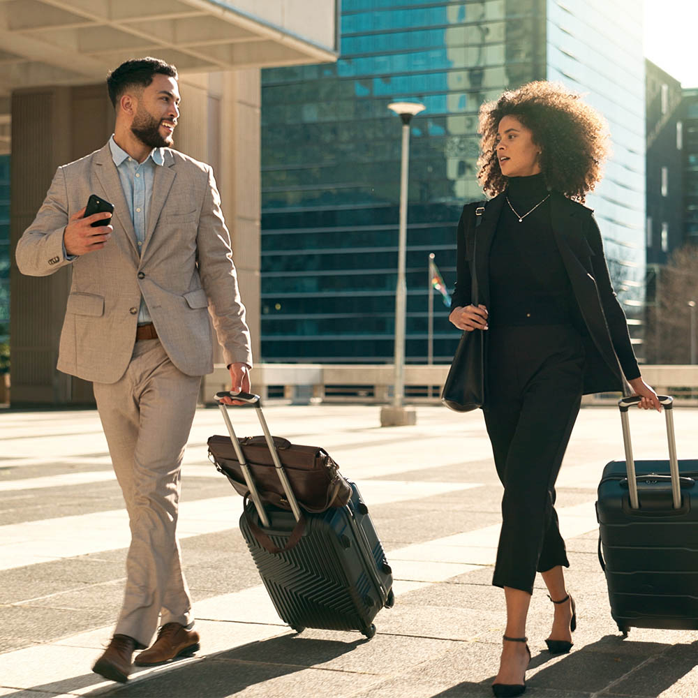 team walking and travel with suitcase in city