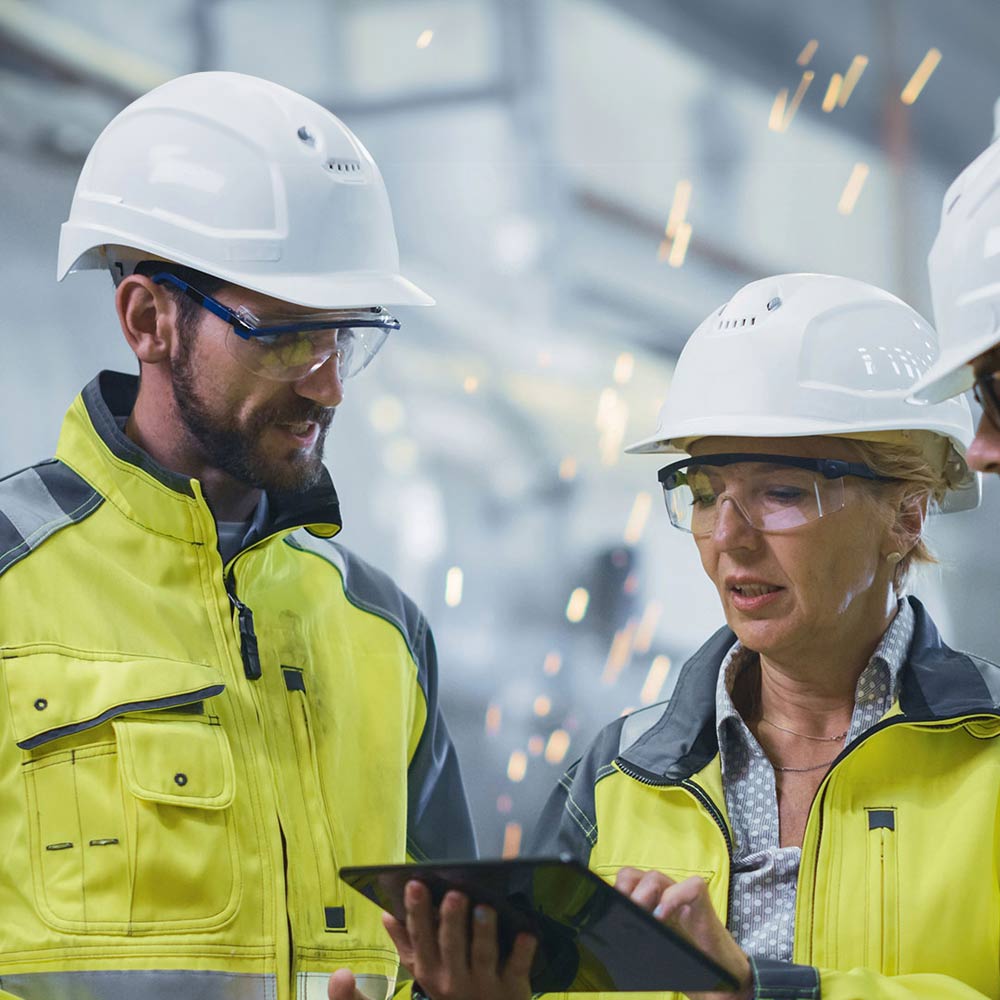 three people working together