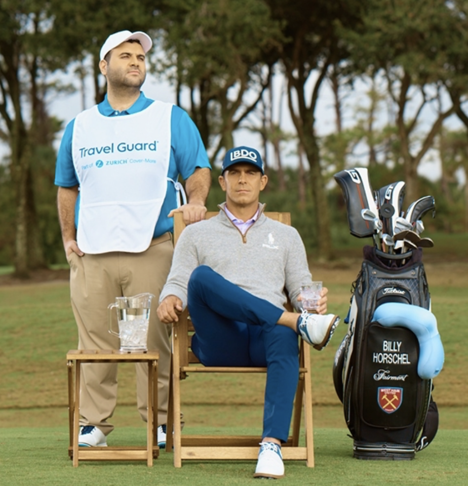 Billy Horschel with a person wearing a Travel Guard shirt