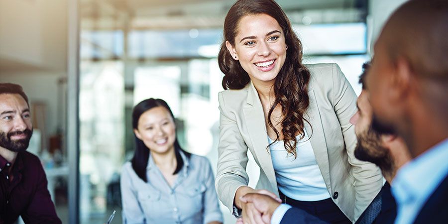 woman and man shaking hands