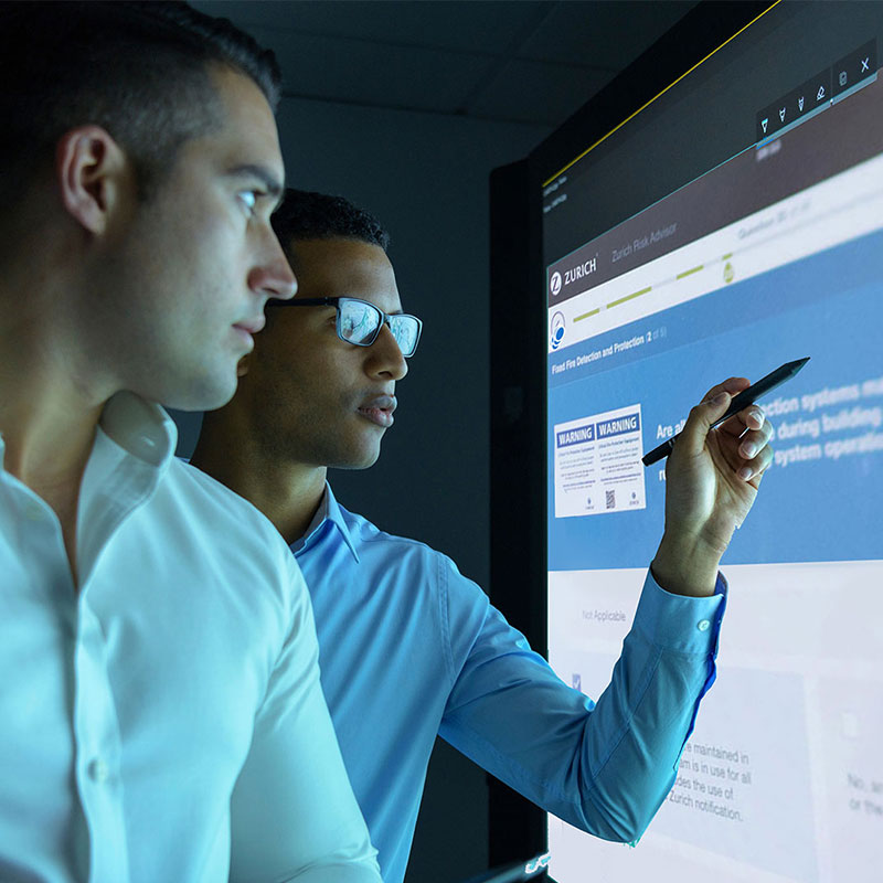 two man working on a screen
