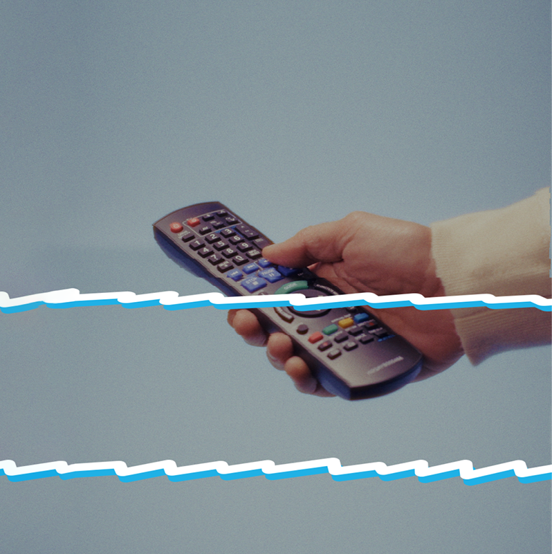 Hand holding remote control