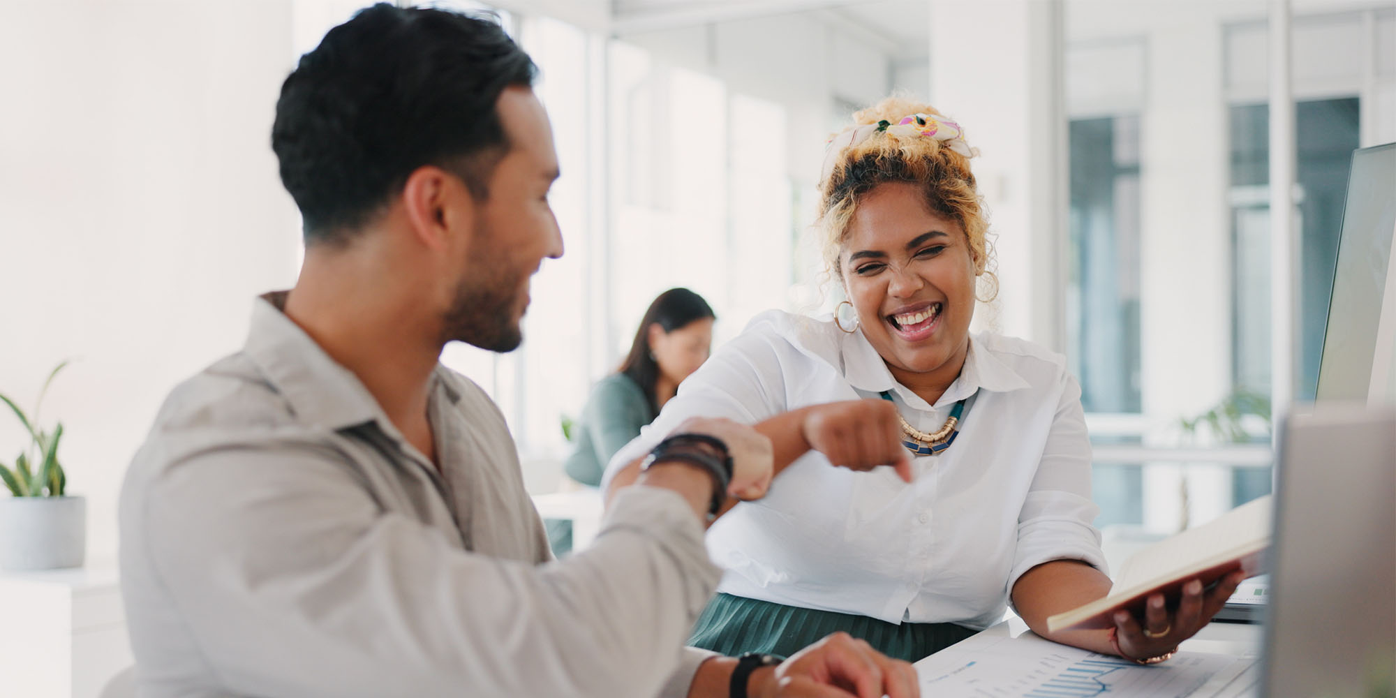 two colleagues celebrating a success