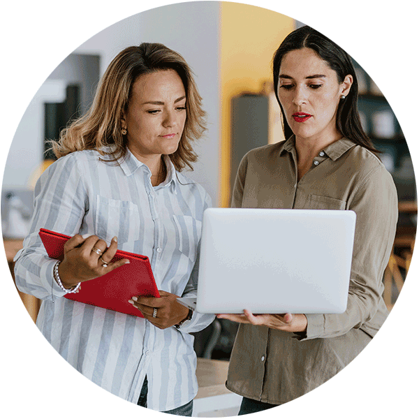 two women looking at a computer screen