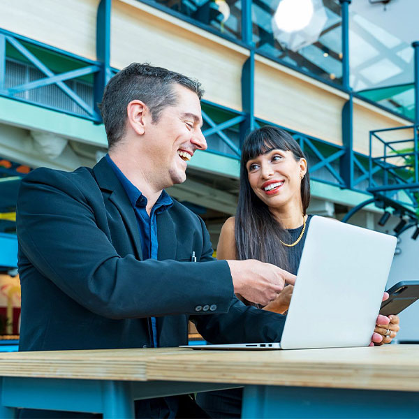 two colleagues looking at a computer