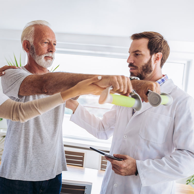A man being treated by a physiotherapist