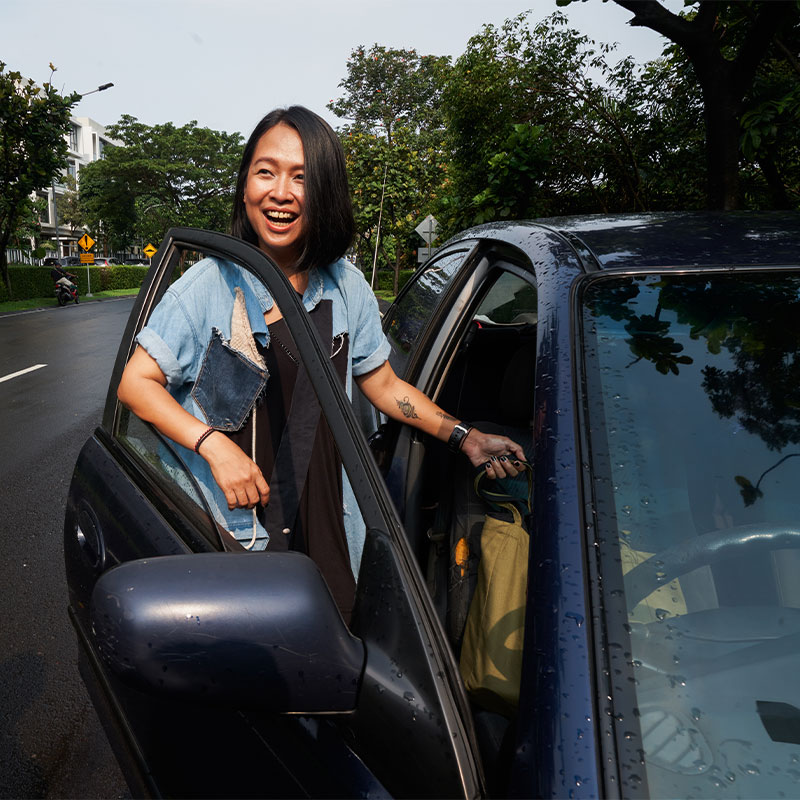Woman getting in a car