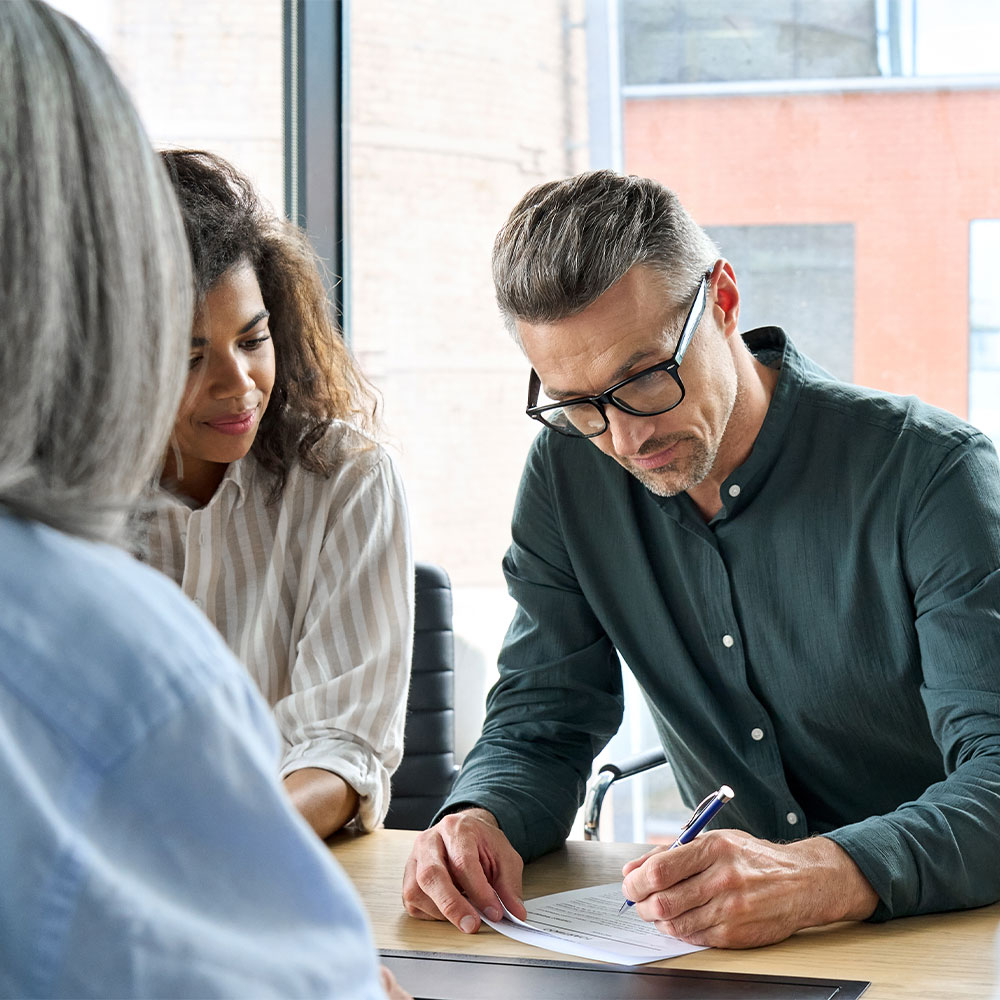 Employees looking at a document