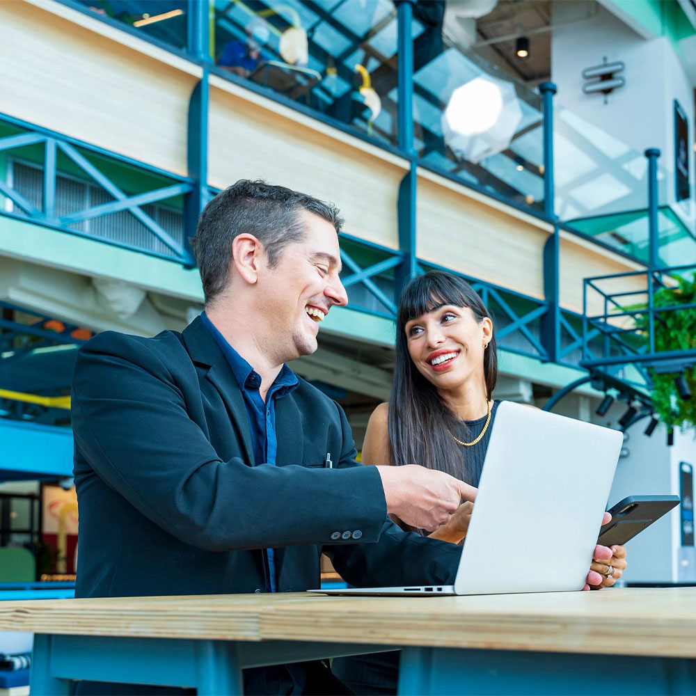 two colleagues looking at a computer
