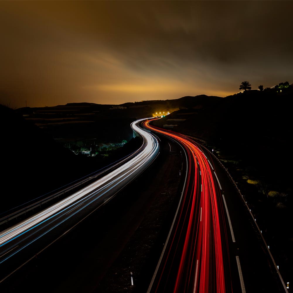 Time lapse photography of highway road at night