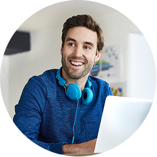 Man with headphones working at laptop