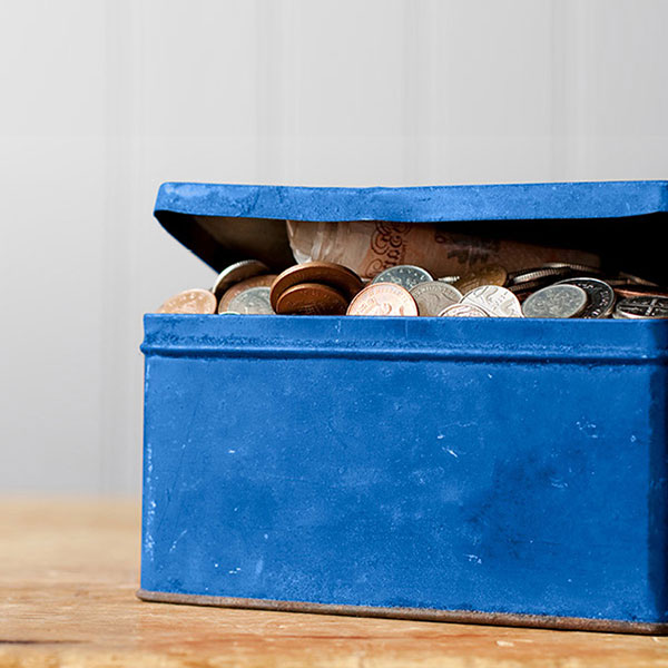 blue tin with coins
