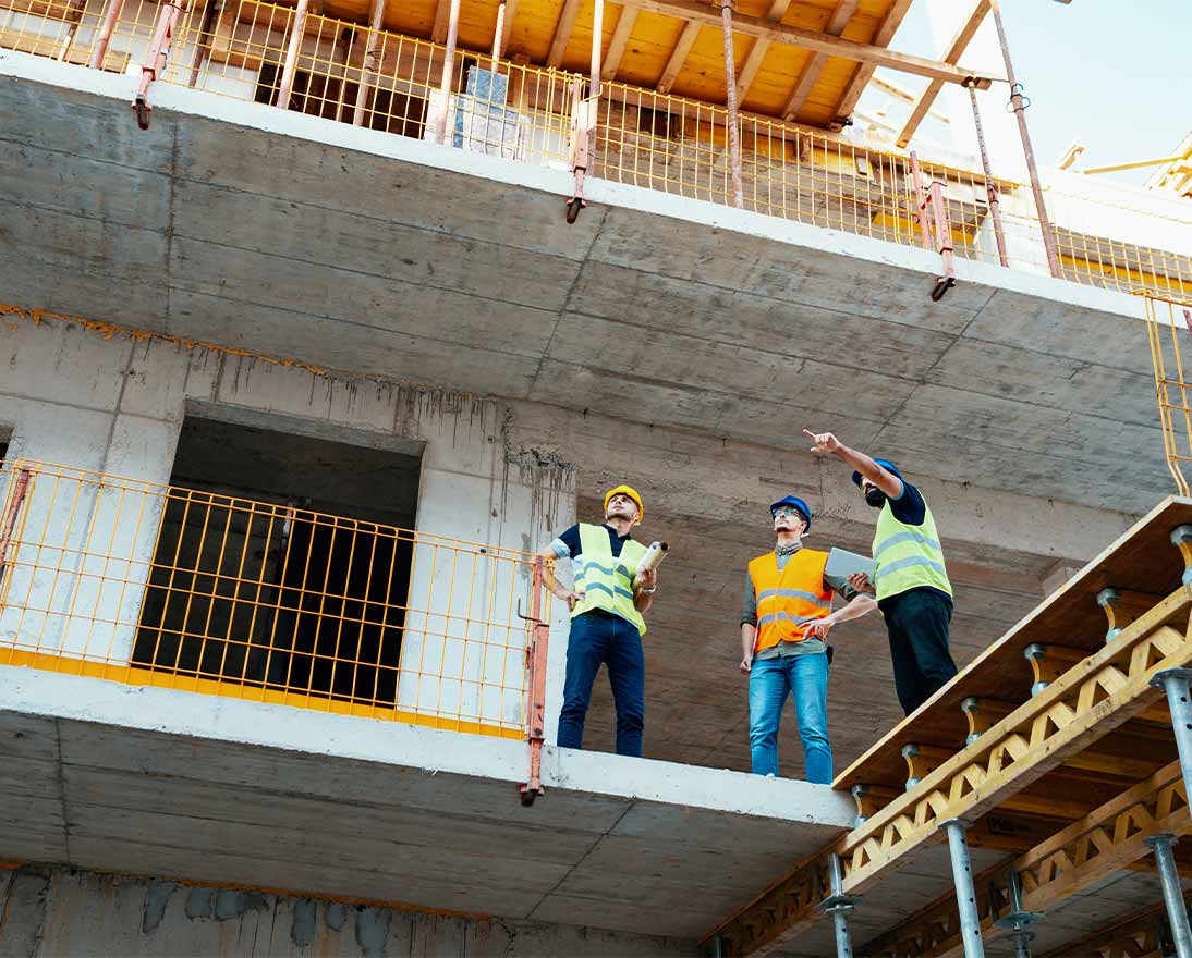 three engineers at a construction site