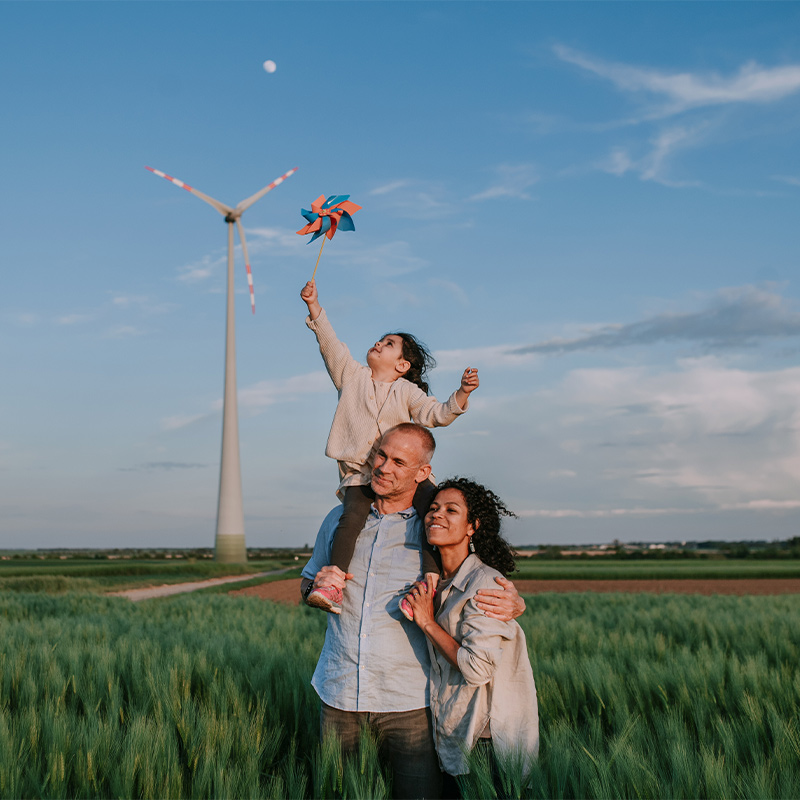 A family in front of a windmill