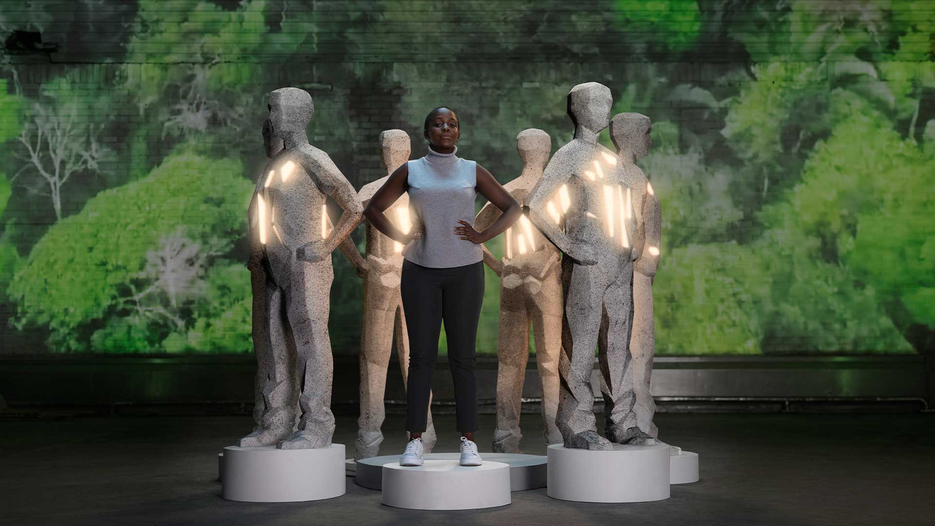 Woman standing with statues