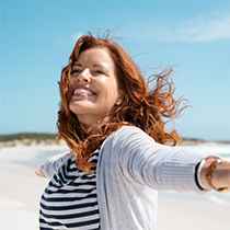 a happy woman on a beach