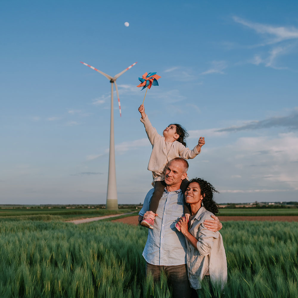 family in front of a windmill