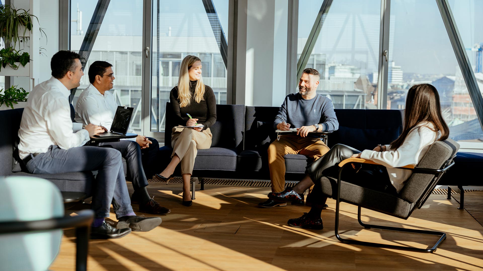 a group of Zurich employees talking